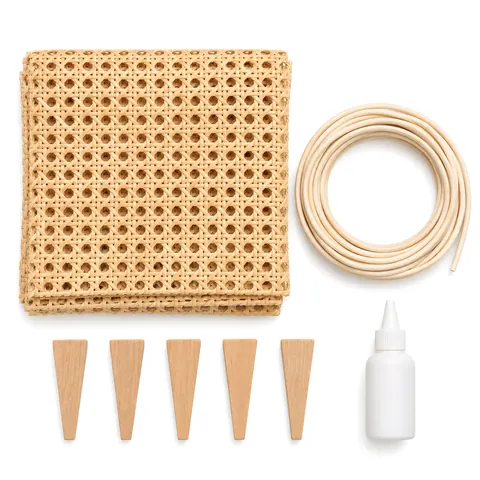 Flat lay of a chair seat caning kit with a sheet of open weave cane webbing and seat caning supplies, on a white background