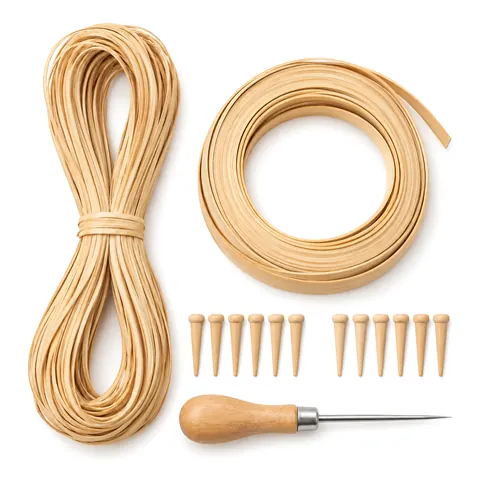 Flat lay of a looped hank of strand cane, a coil of binder cane, twelve wooden pegs and an awl on peach paper, on a white background