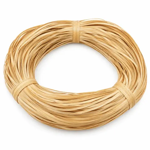 Large looped hank of glossy honey-blond strand chair cane tied in three places, on a white background
