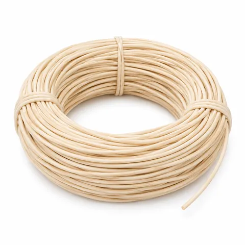 Coil of smooth, matte, pale cream round reed for basket weaving, tied, on a white background