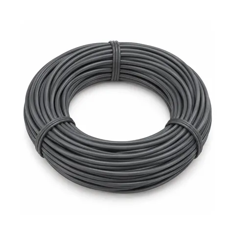 Tied coil of smooth dark grey round PE wicker strand on pale lavender paper, on a white background