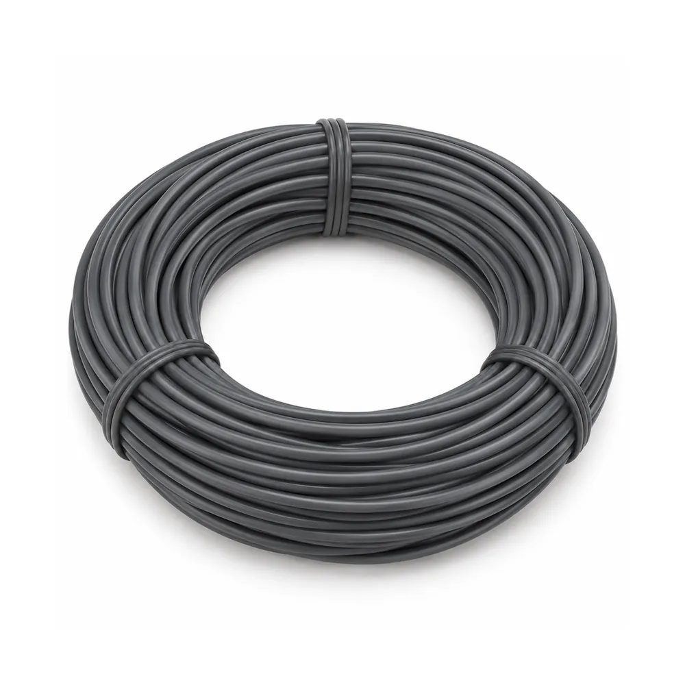 Tied coil of smooth dark grey round PE wicker strand on pale lavender paper, on a white background