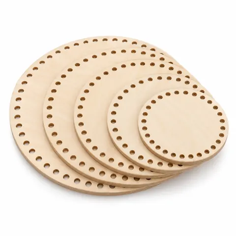 Five round plywood basket bases from small to large, fanned out, each with a ring of drilled holes, on white