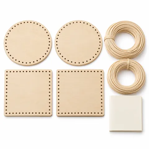 Four small finished natural reed baskets, two round and two square, woven on wooden bases, grouped on white