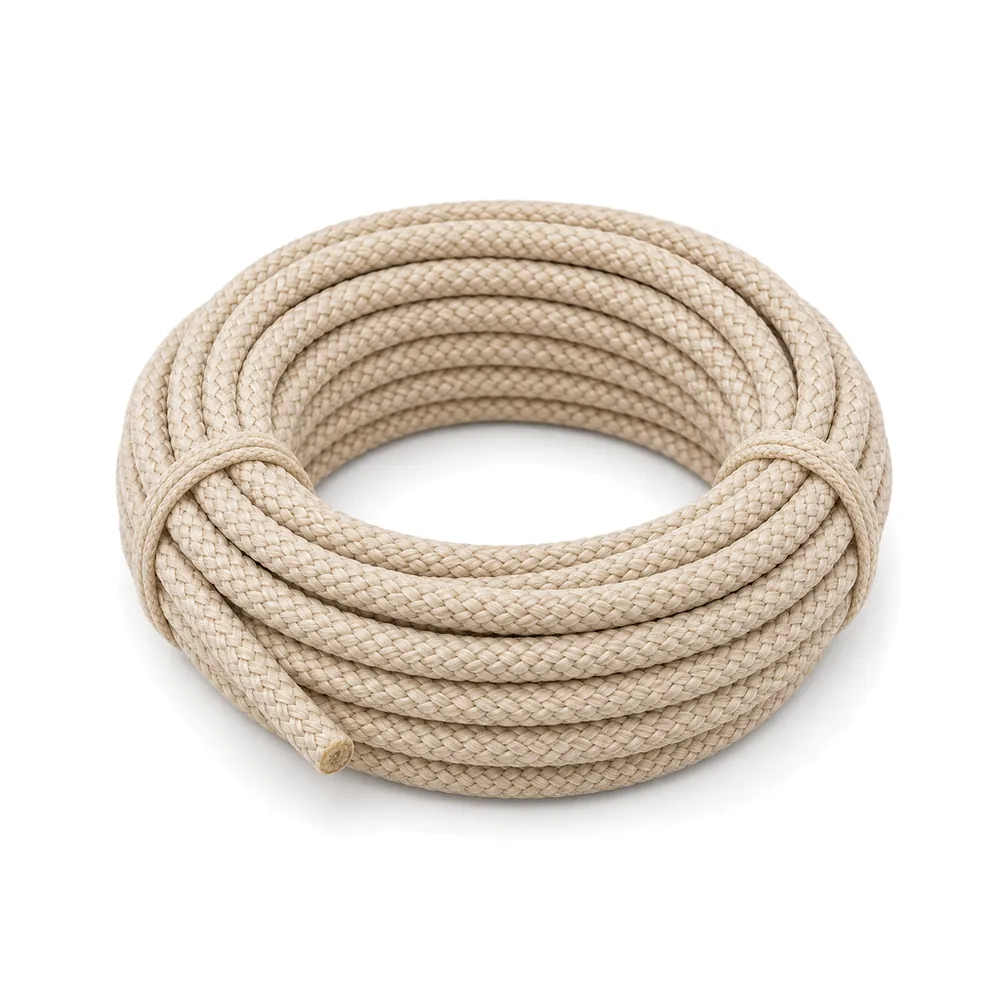 Neat tied coil of soft braided oatmeal colored outdoor rope on a white background