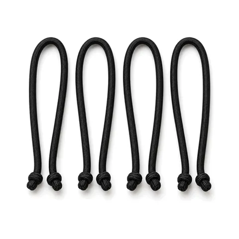 Four black elastic bungee cords with knotted ends laid side by side in neat loops on a white background